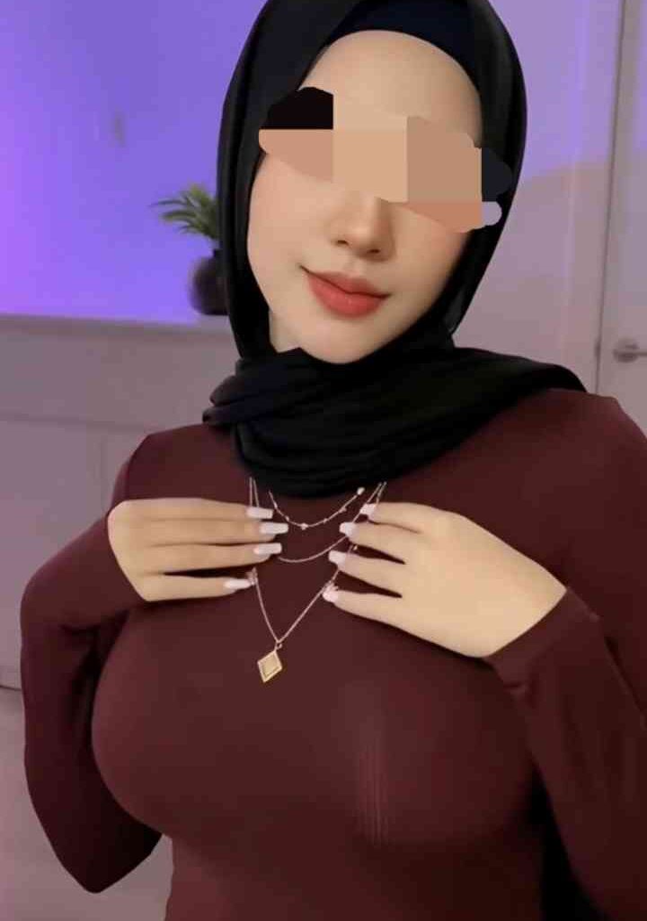 Petite 22yo Malay woman in hijab and maroon top, with necklace