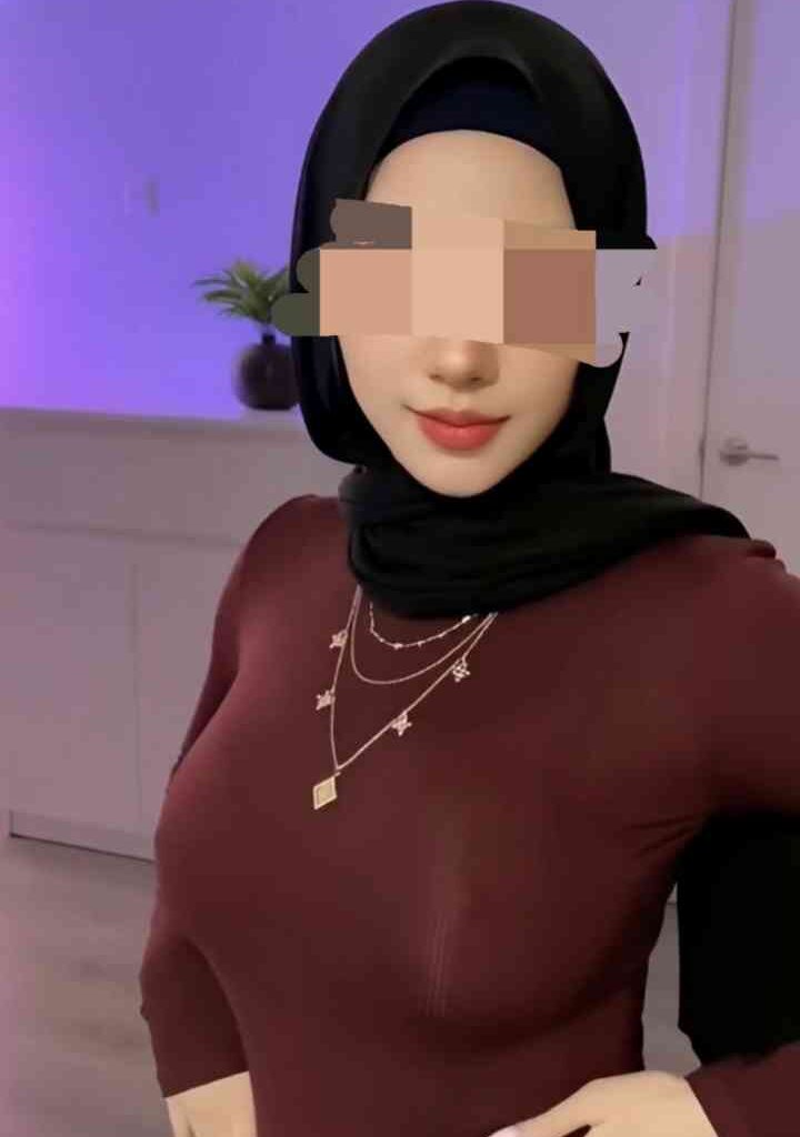 Petite 22yo Malay woman in hijab and maroon top, KL escort.